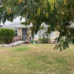 real estate house with a front ramp, and large windows